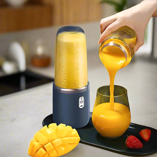 Homefish portable blender with colorful juice cups, mango, and berries on a yellow background